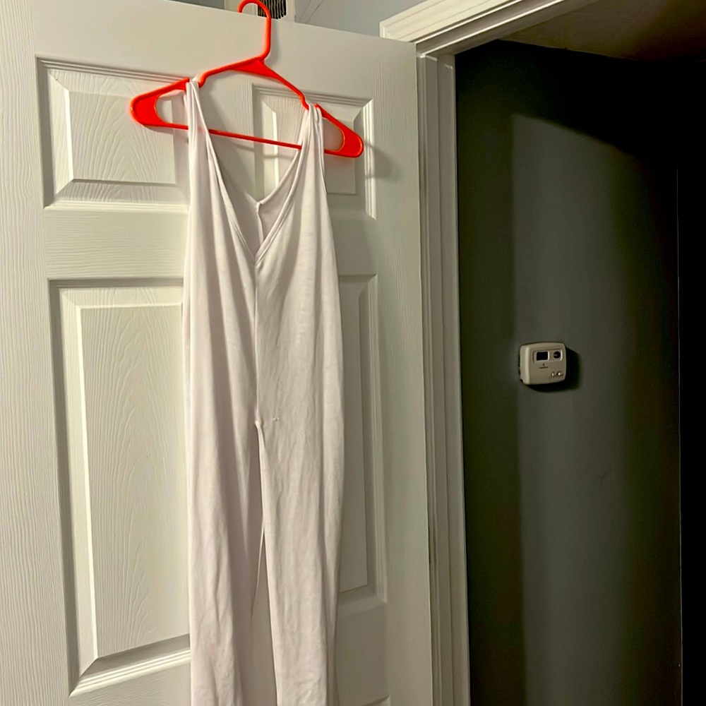 Sleeveless white top split down the middle